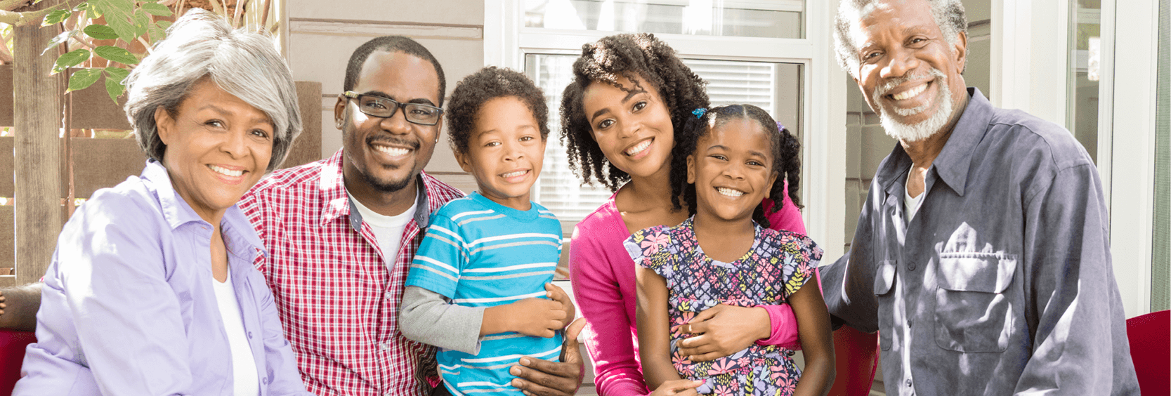 1200x406_401k family Multi-generational family smiling for a portrait