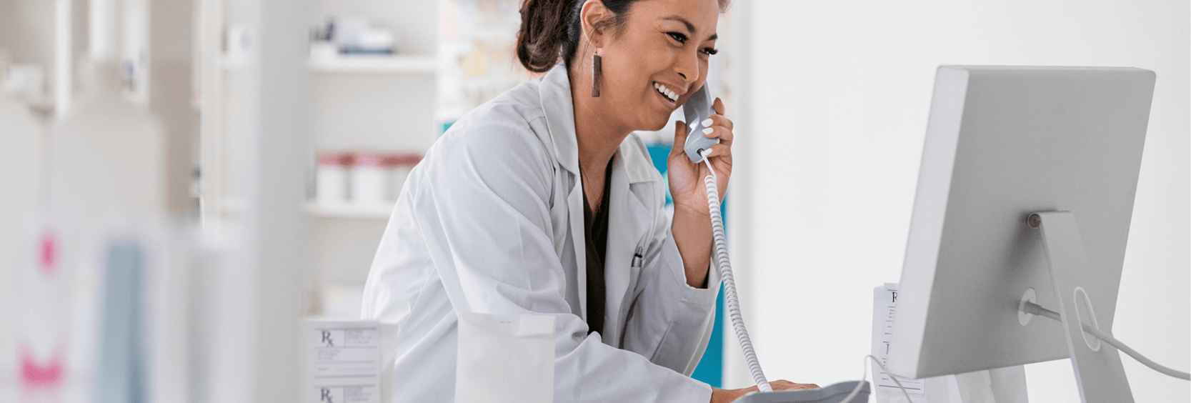 1200x406_Glossary of Terms Healthcare professional on phone and computer