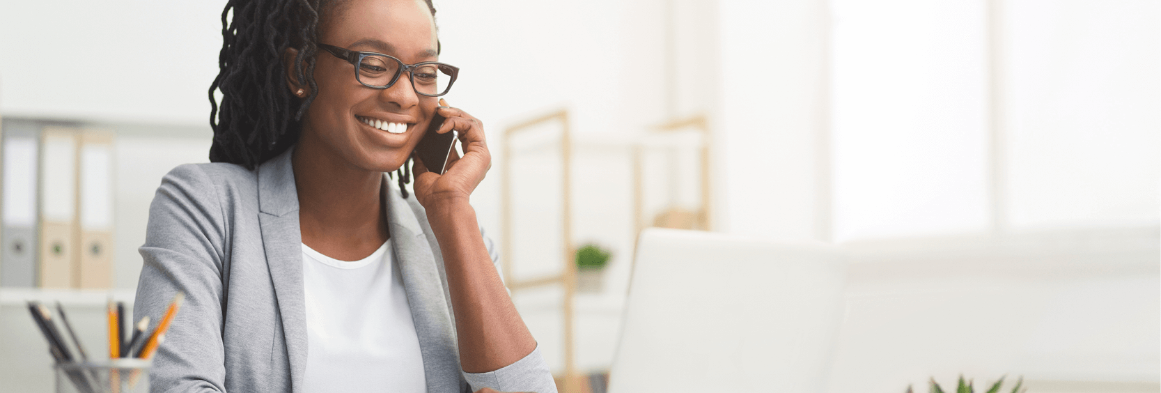 Woman on mobile phone and computer