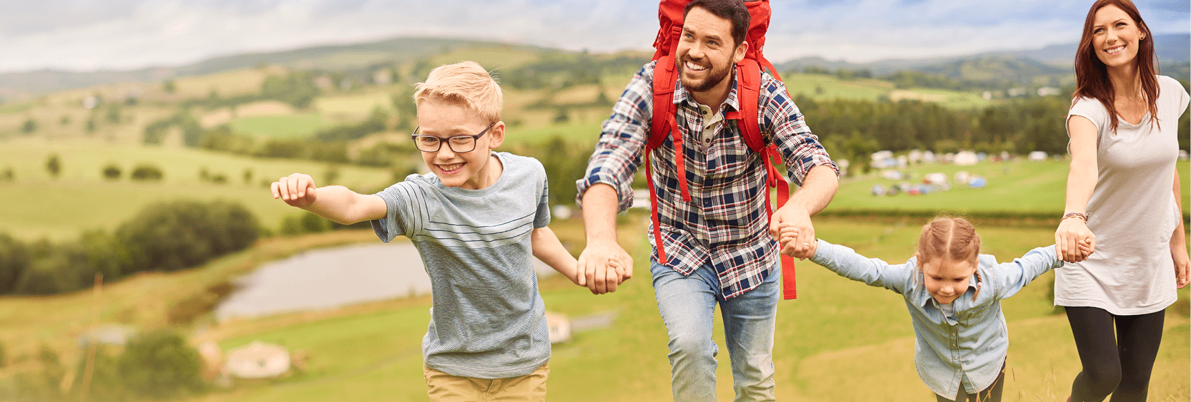 1200x406_PTO Family hiking on a hill