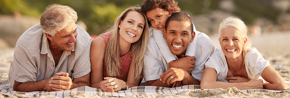 1200x406_IdentityWorks Family on the beach.